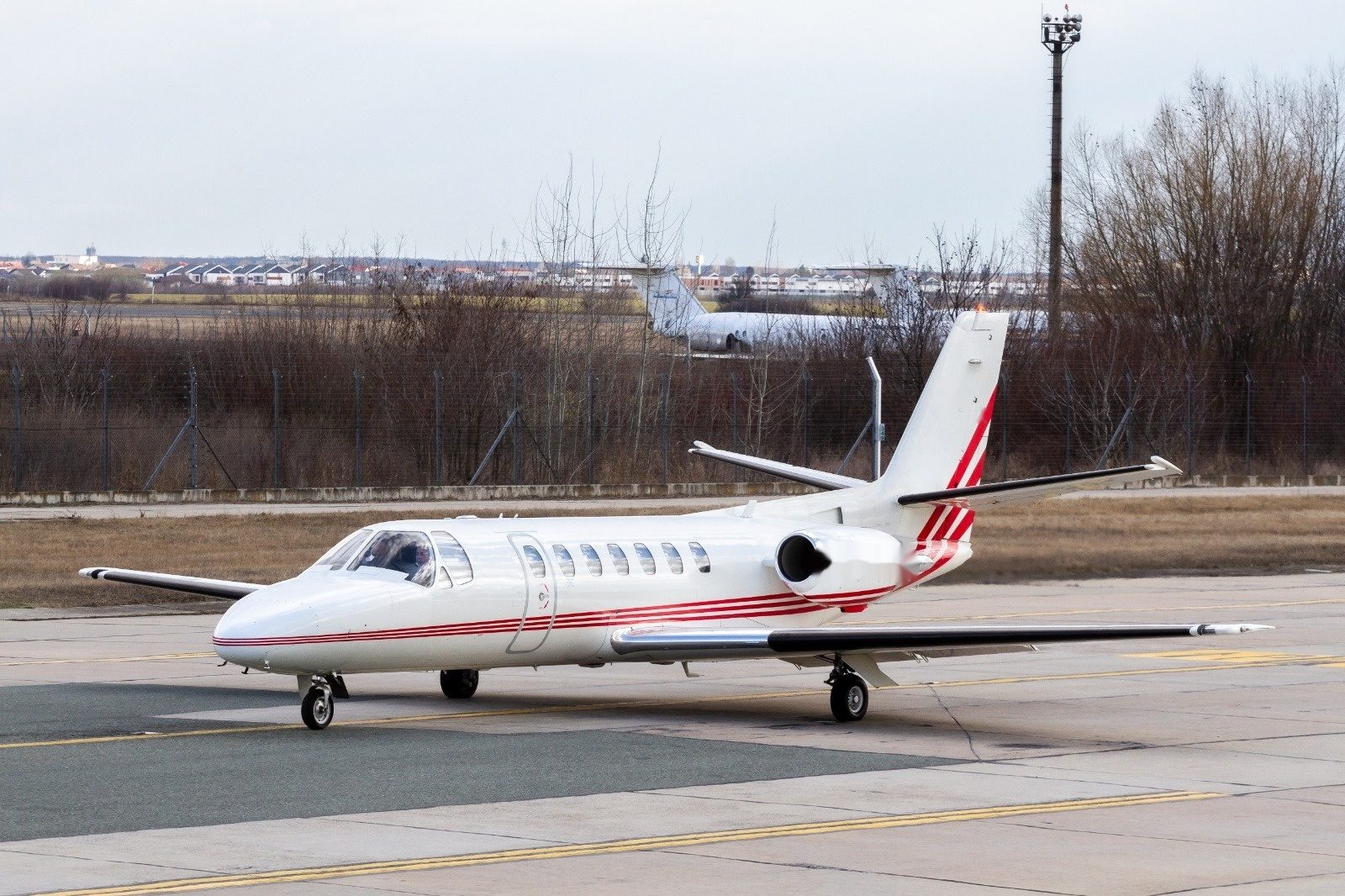 Cessna Citation V air ambulance jet in flight, exterior side view