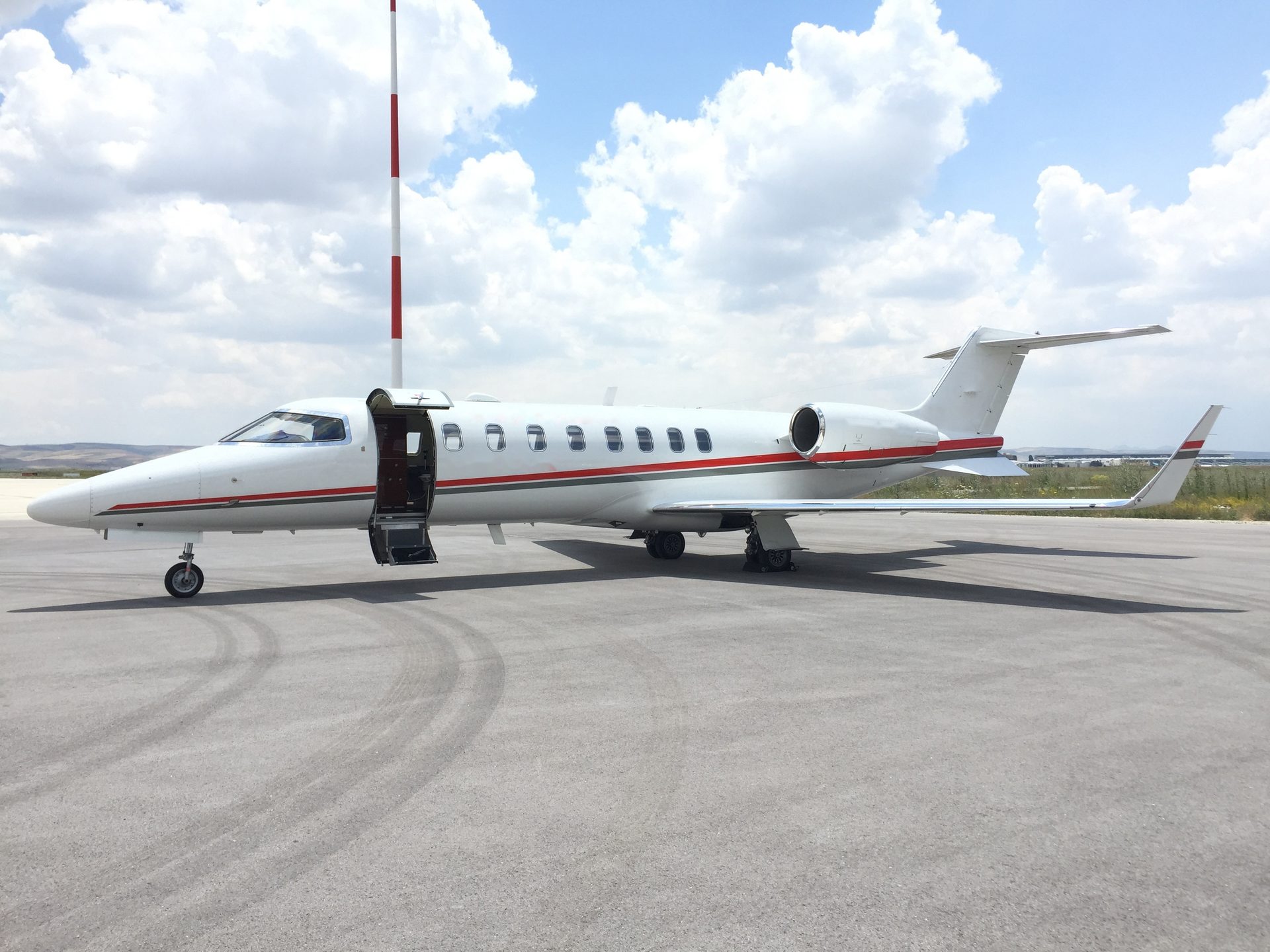 Learjet 45XR air ambulance jet taking off, exterior side view