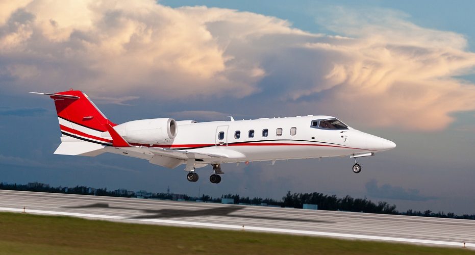 Learjet 60 air ambulance jet landing, exterior side view