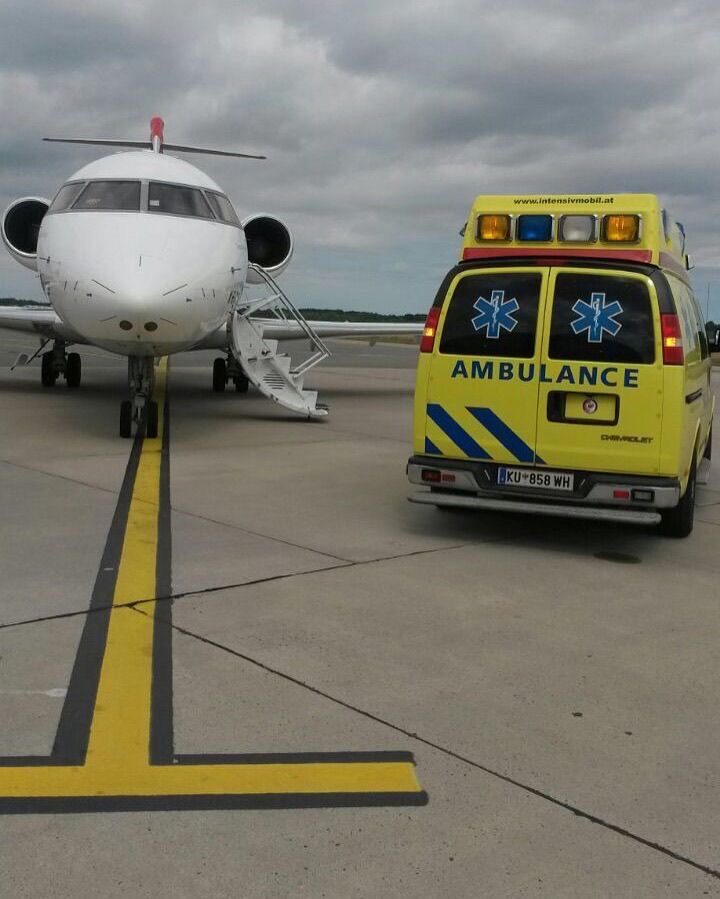 Ambulance Flight aircraft and ground ambulance on the tarmac during a real mission