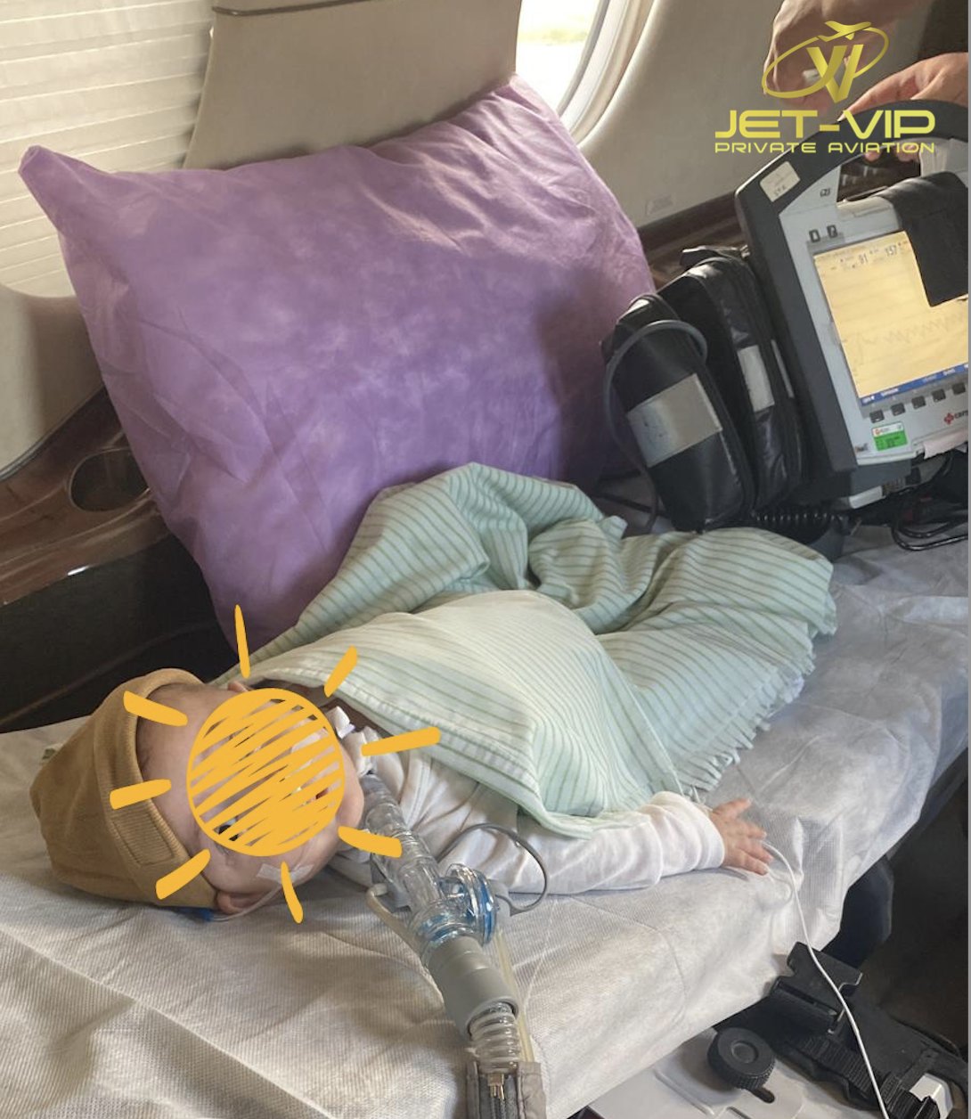 Newborn patient prepared for transport in a specialist neonatal incubator